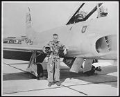 Photograph of William S. Willis posing beside Air Force plane